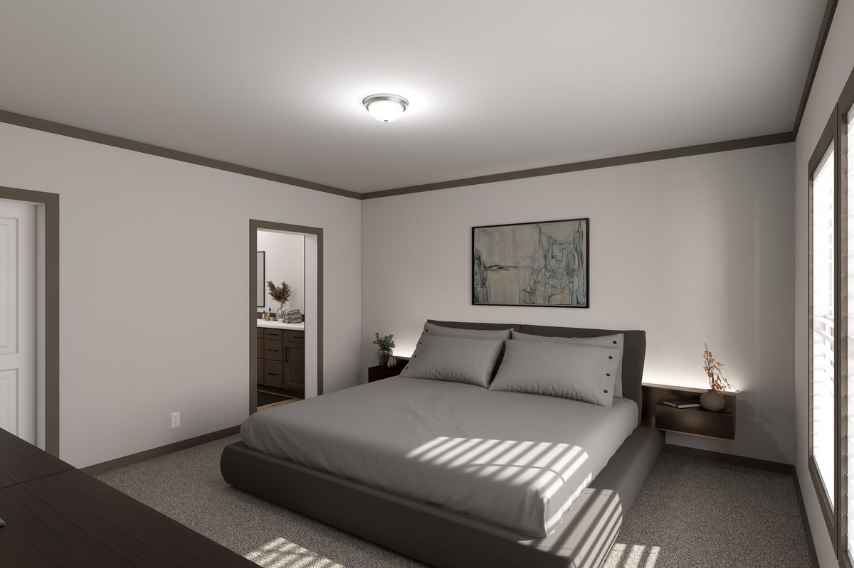 The EASY LIVIN' Primary Bedroom. This Manufactured Mobile Home features 3 bedrooms and 2 baths.