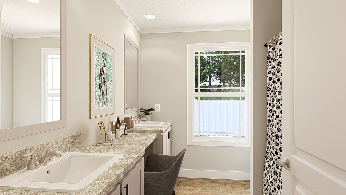 The THE BREEZE 64 Guest Bathroom. This Manufactured Mobile Home features 4 bedrooms and 2 baths.