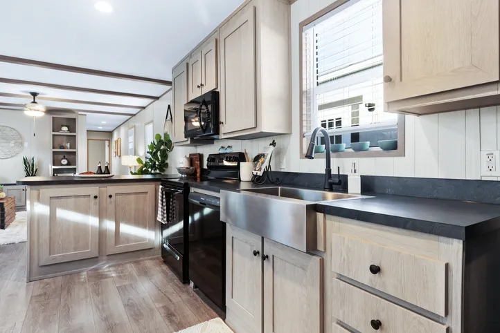 The ANNIVERSARY 16763A Kitchen. This Manufactured Mobile Home features 3 bedrooms and 2 baths.