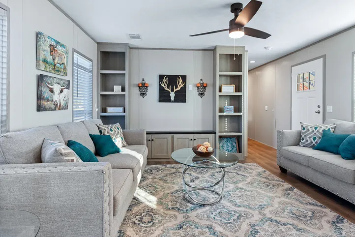 The RESOLUTION 16763J Living Room. This Manufactured Mobile Home features 3 bedrooms and 2 baths.