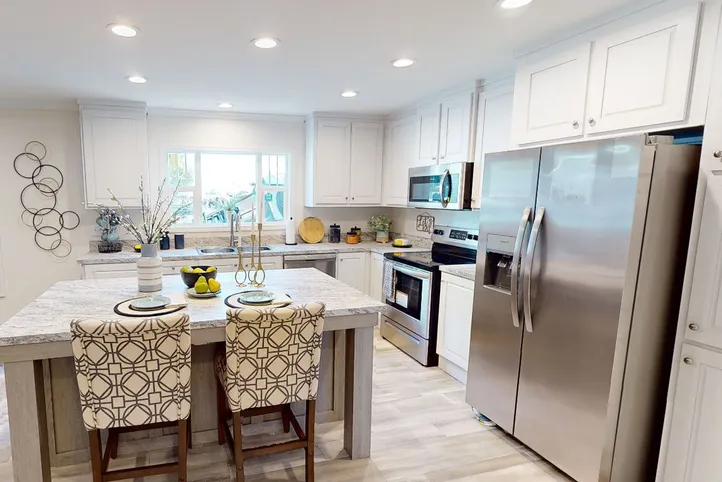 The 4215 "SUNRISE" 6428 Kitchen. This Manufactured Mobile Home features 3 bedrooms and 2 baths.