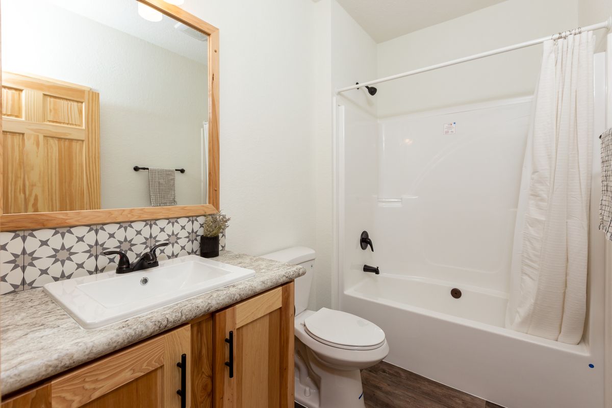 The LEGACY 412 Guest Bathroom. This Manufactured Mobile Home features 3 bedrooms and 2 baths.