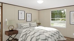 The GLORY Primary Bedroom. This Manufactured Mobile Home features 3 bedrooms and 2 baths.