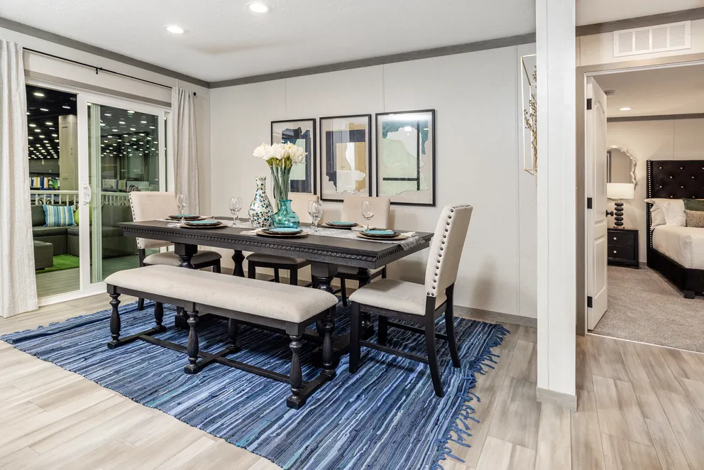 The 6428-E792 THE PULSE Dining Room. This Manufactured Mobile Home features 3 bedrooms and 2.5 baths.