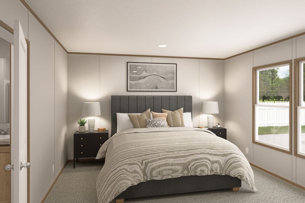 The THE EAGLE 60 Primary Bedroom. This Manufactured Mobile Home features 3 bedrooms and 2 baths.