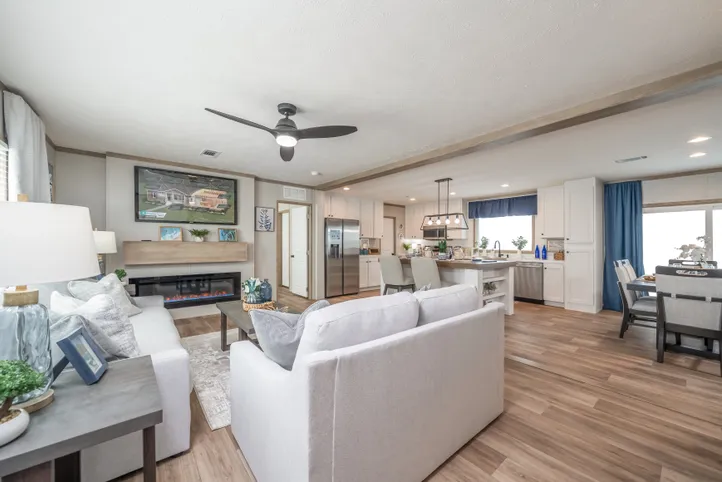 The EL SUENO BREEZE Living Room. This Manufactured Mobile Home features 4 bedrooms and 2 baths.