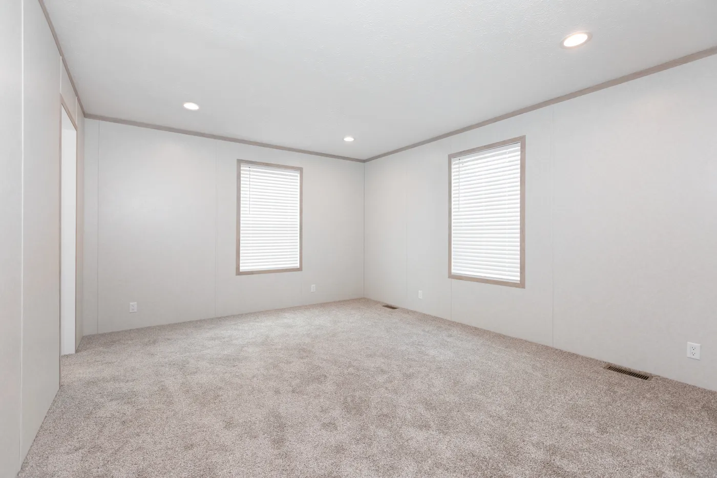 The 5628-5202 ADRENALINE Primary Bedroom. This Manufactured Mobile Home features 3 bedrooms and 2 baths.