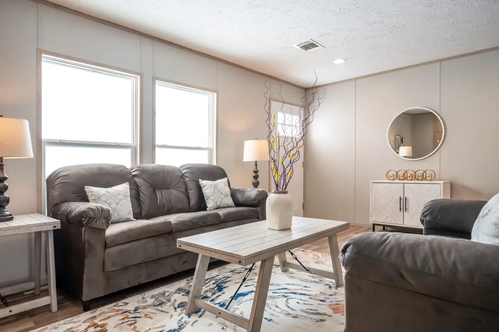 The RIO Living Room. This Manufactured Mobile Home features 3 bedrooms and 2 baths.