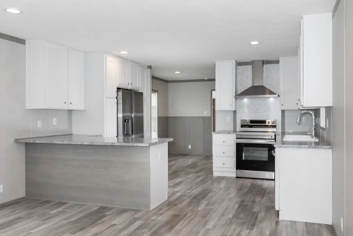The THE POWERHOUSE Kitchen. This Manufactured Mobile Home features 3 bedrooms and 2 baths.