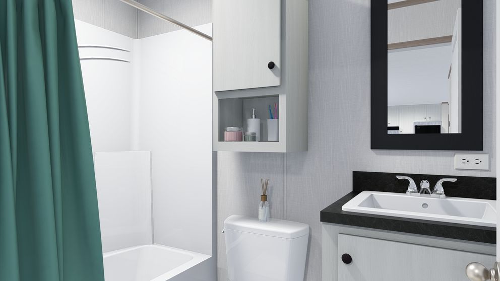 The 5228-5785 THE PULSE Guest Bathroom. This Manufactured Mobile Home features 3 bedrooms and 2 baths.