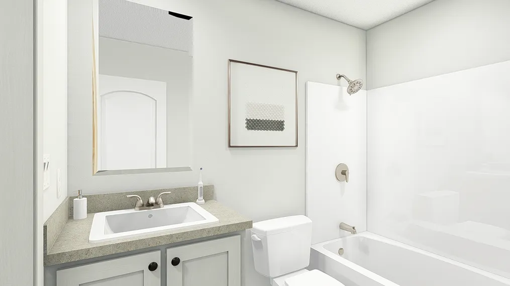 The UNDER PRESSURE Guest Bathroom. This Manufactured Mobile Home features 3 bedrooms and 2 baths.