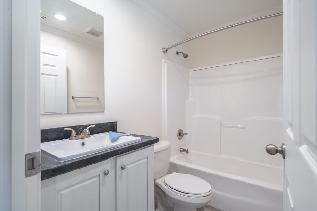 The 4200 "SOUTHPORT" 58'4X16 Guest Bathroom. This Manufactured Mobile Home features 2 bedrooms and 2 baths.