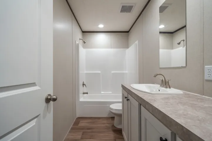 The EMPOWER Guest Bathroom. This Manufactured Mobile Home features 4 bedrooms and 2 baths.