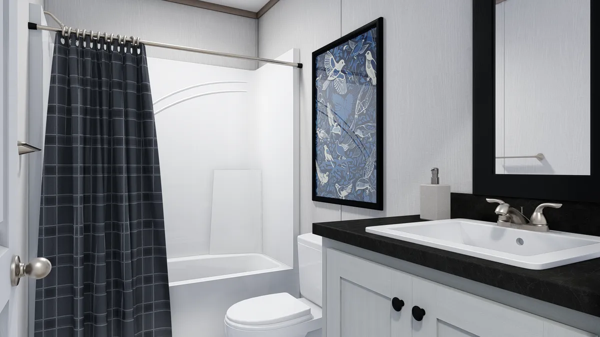 The 4028-E751 THE PULSE Guest Bathroom. This Manufactured Mobile Home features 3 bedrooms and 2 baths.