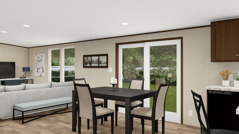 The PRIDE Dining Area. This Manufactured Mobile Home features 4 bedrooms and 2 baths.