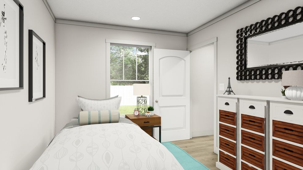 The SATISFACTION Bedroom. This Manufactured Mobile Home features 2 bedrooms and 1 bath.