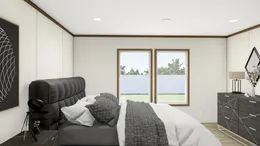 The DISCOVER Primary Bedroom. This Manufactured Mobile Home features 3 bedrooms and 2 baths.