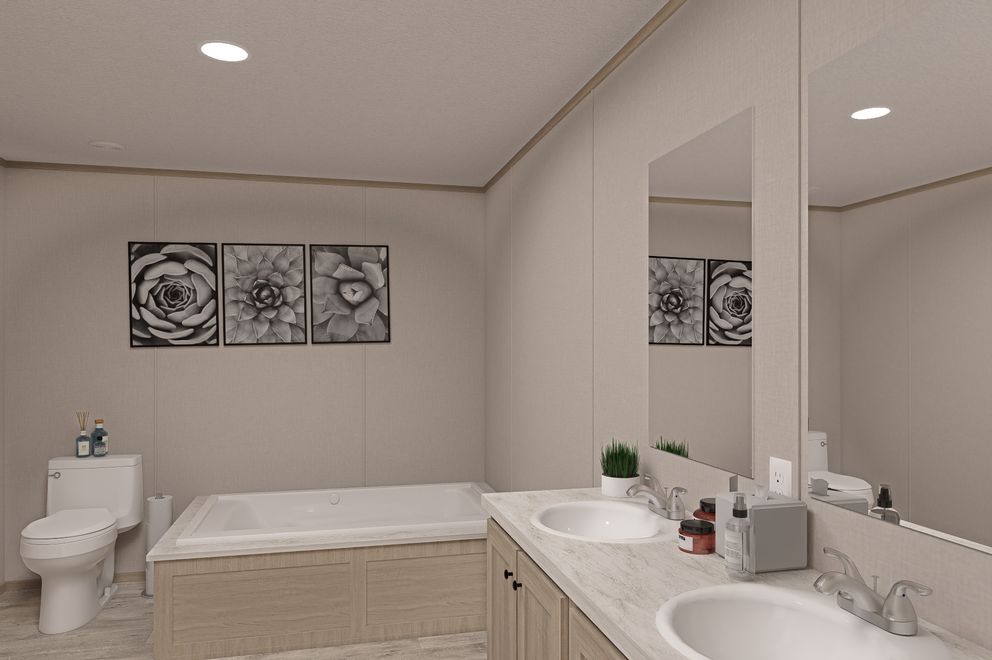 The THE EAGLE 68 Primary Bathroom. This Manufactured Mobile Home features 4 bedrooms and 2 baths.