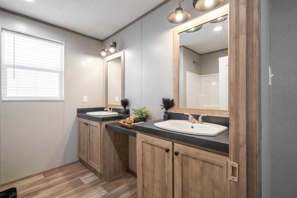 The TRADITION 72 Guest Bathroom. This Manufactured Mobile Home features 3 bedrooms and 2 baths.