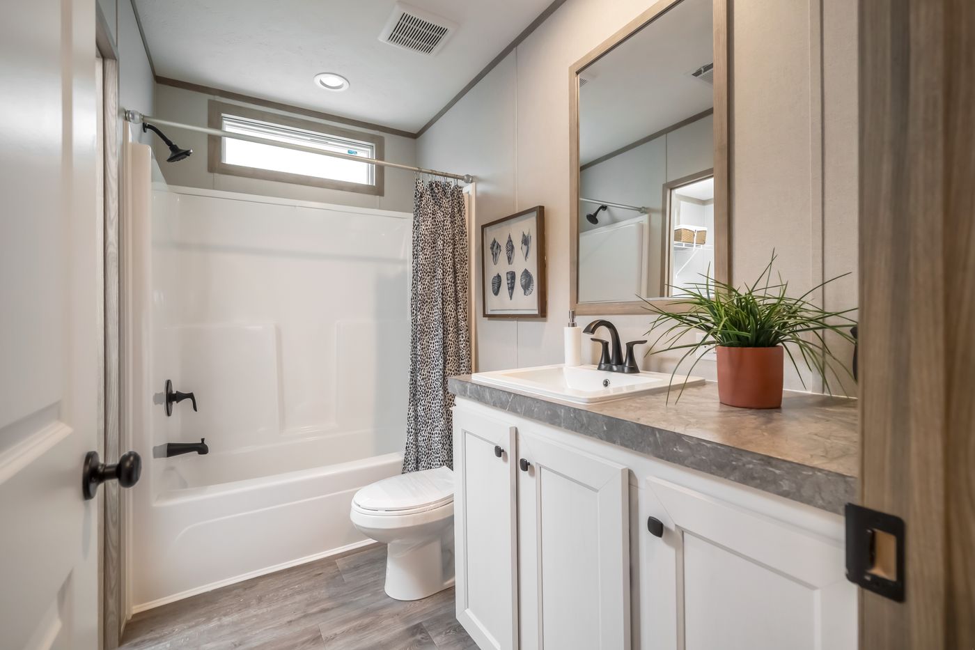 The PT 78 Guest Bathroom. This Manufactured Mobile Home features 3 bedrooms and 2 baths.