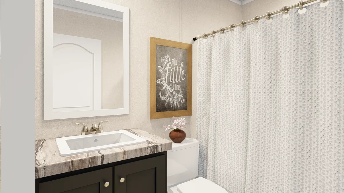 The GRAND LIVING 76B Guest Bathroom. This Manufactured Mobile Home features 3 bedrooms and 2 baths.
