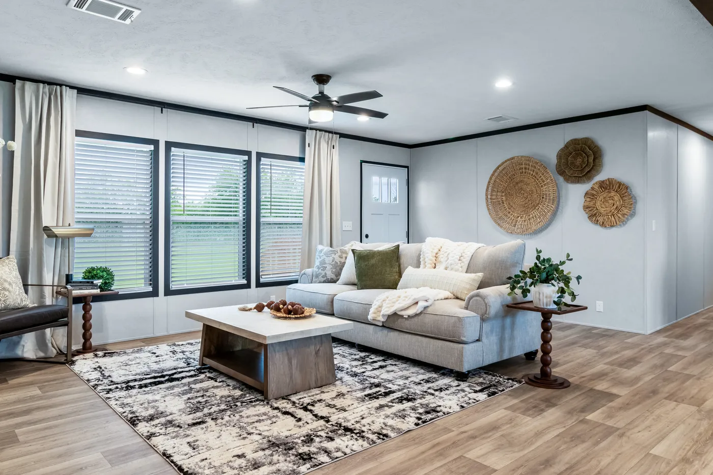 The ODYSSEY Living Room. This Manufactured Mobile Home features 4 bedrooms and 2 baths.