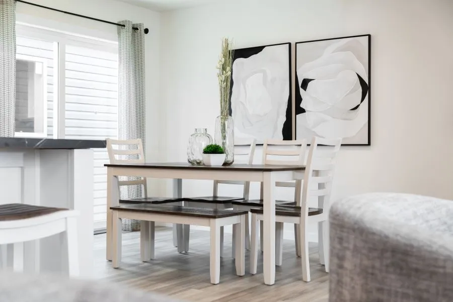 The BUTLER PLACE/6428-MS056 SECT Dining Area. This Manufactured Mobile Home features 3 bedrooms and 3 baths.