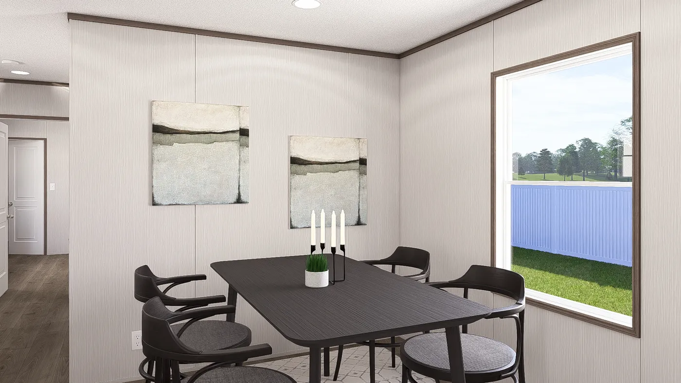 The LEGEND ANNIVERSARY 16X76 Dining Area. This Manufactured Mobile Home features 3 bedrooms and 2 baths.