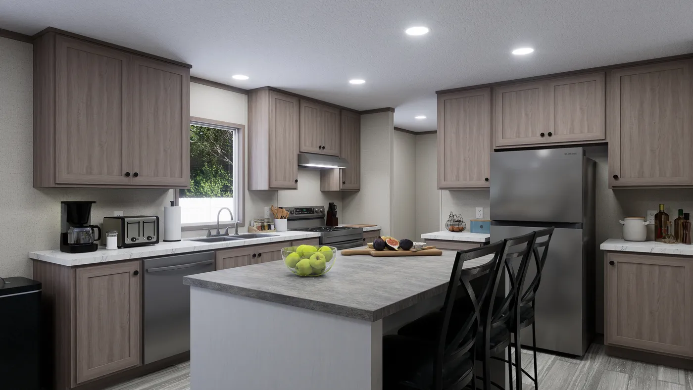 The THE MOUNTAINEER 60 Kitchen. This Manufactured Mobile Home features 3 bedrooms and 2 baths.
