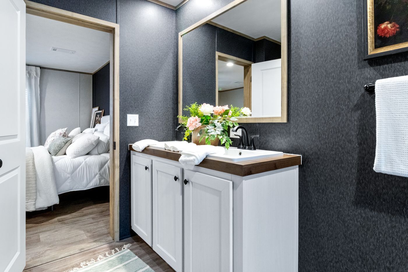 The EL SUENO BREEZE Primary Bathroom. This Manufactured Mobile Home features 4 bedrooms and 2 baths.
