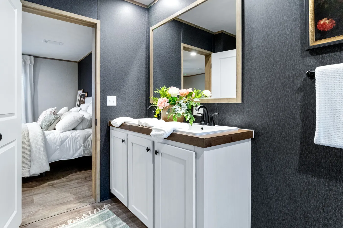 The EL SUENO BREEZE Primary Bathroom. This Manufactured Mobile Home features 4 bedrooms and 2 baths.
