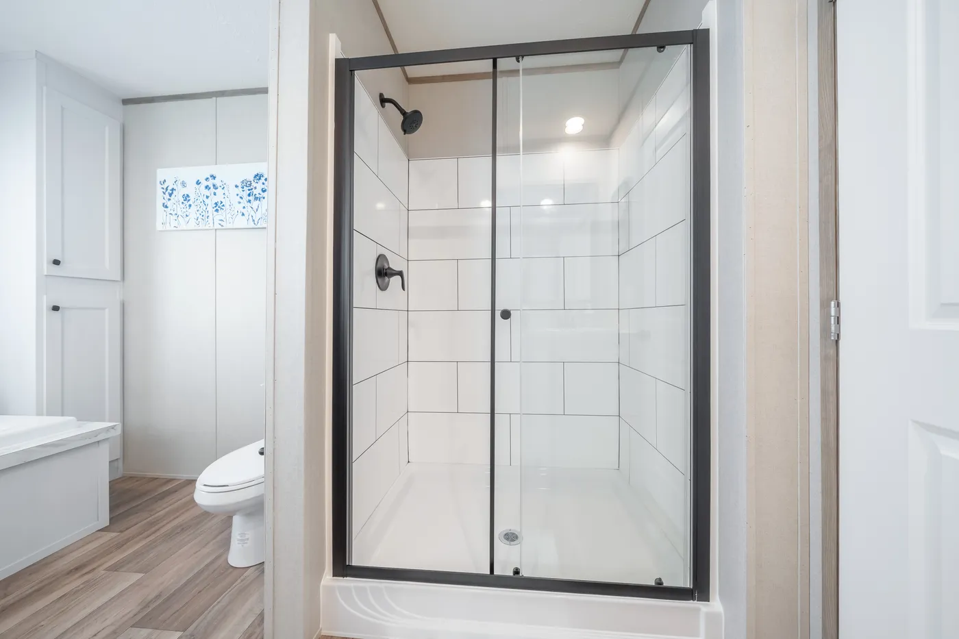 The EL SUENO BREEZE Primary Bathroom. This Manufactured Mobile Home features 4 bedrooms and 2 baths.