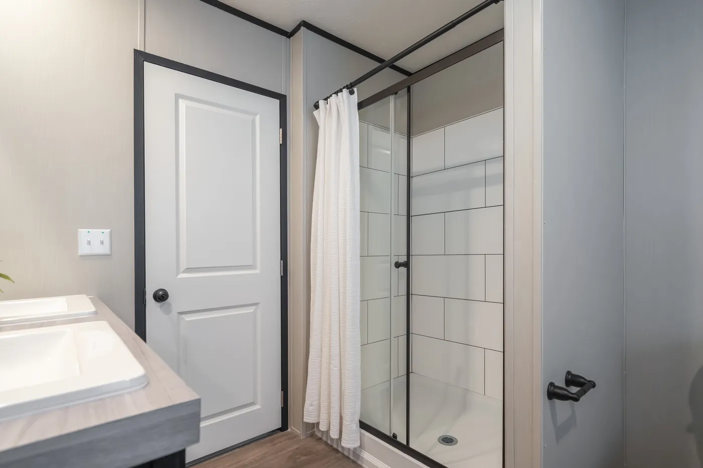The CRAZY EIGHTS Primary Bathroom. This Manufactured Mobile Home features 4 bedrooms and 2 baths.