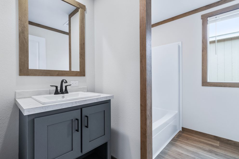 The FARM 3 FLEX Guest Bathroom. This Manufactured Mobile Home features 3 bedrooms and 2 baths.