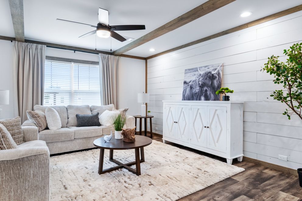 The SAWYER ELITE Living Room. This Manufactured Mobile Home features 3 bedrooms and 2 baths.