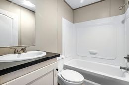 The ANNIVERSARY 16763F Guest Bathroom. This Manufactured Mobile Home features 3 bedrooms and 2 baths.