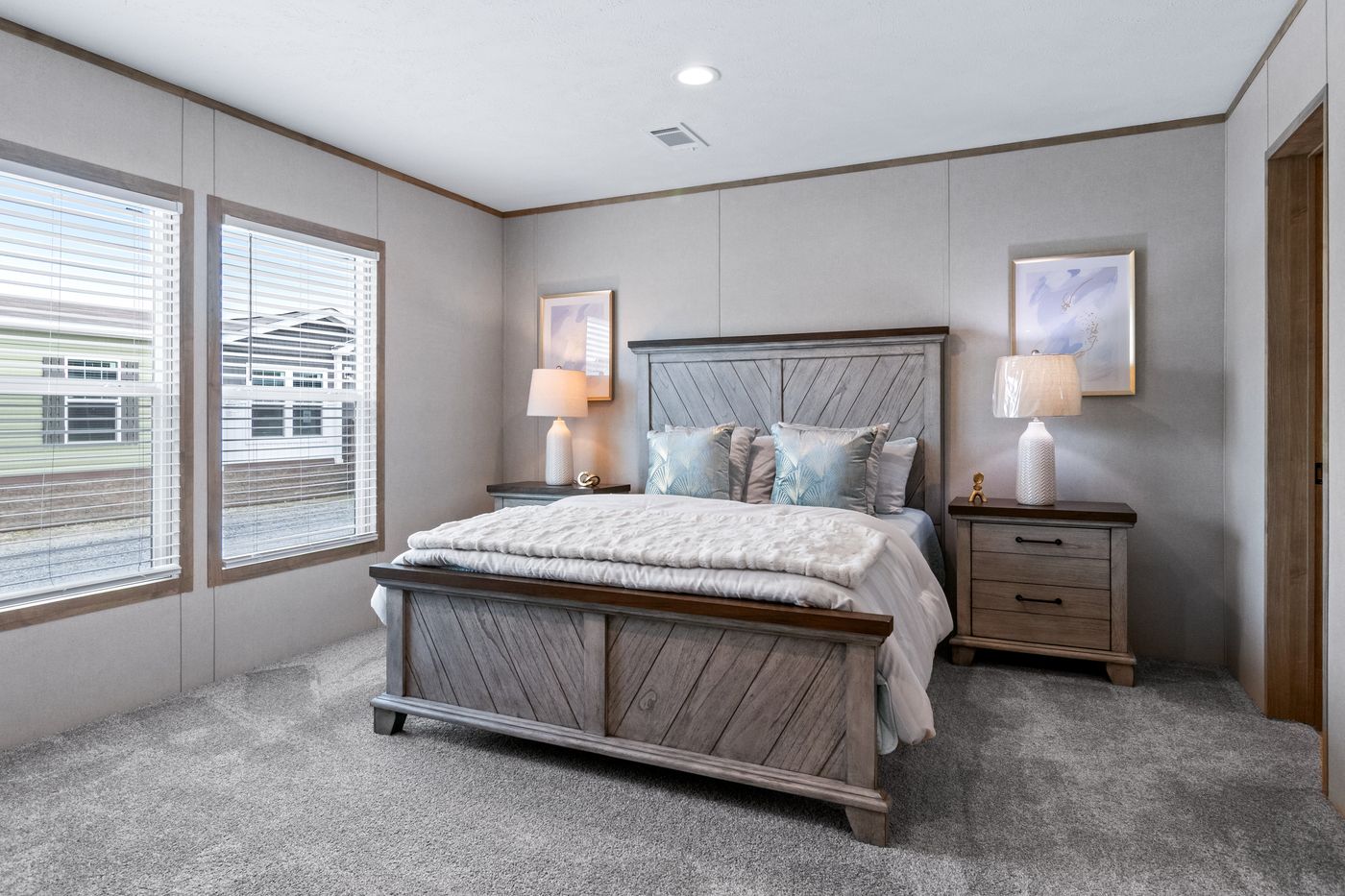 The THE CHOICE Primary Bedroom. This Manufactured Mobile Home features 4 bedrooms and 2 baths.