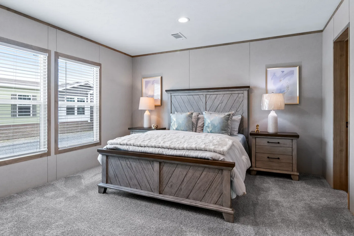 The THE CHOICE Primary Bedroom. This Manufactured Mobile Home features 4 bedrooms and 2 baths.