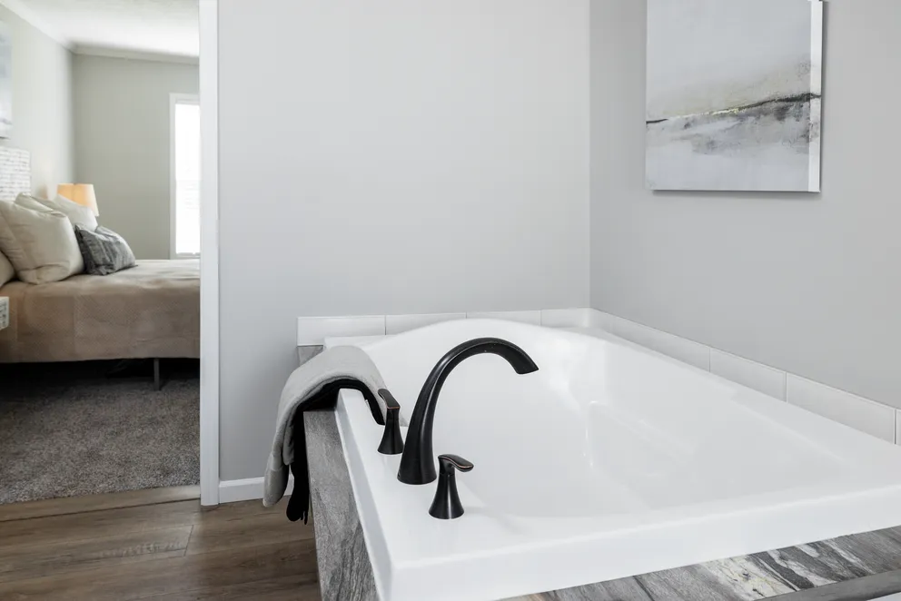 The THE JEFFERSON Primary Bathroom. This Manufactured Mobile Home features 3 bedrooms and 2 baths.