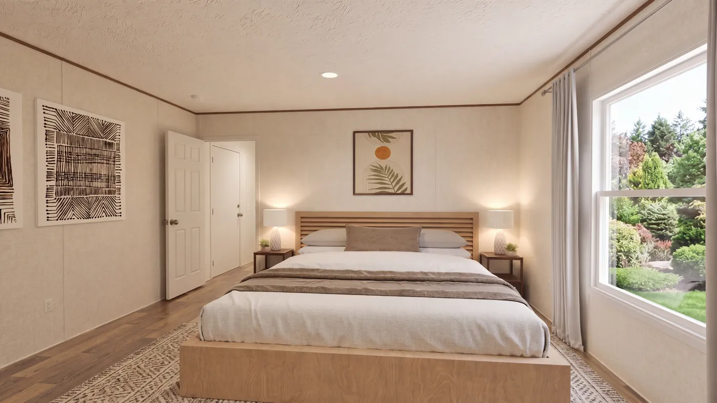 The MAGNOLIA Primary Bedroom. This Manufactured Mobile Home features 3 bedrooms and 2 baths.