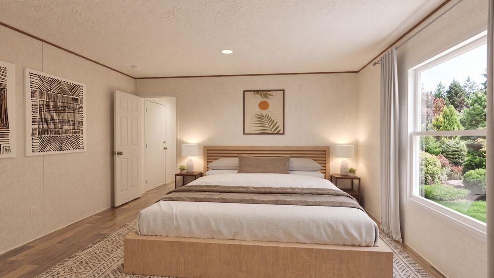The MAGNOLIA Primary Bedroom. This Manufactured Mobile Home features 3 bedrooms and 2 baths.