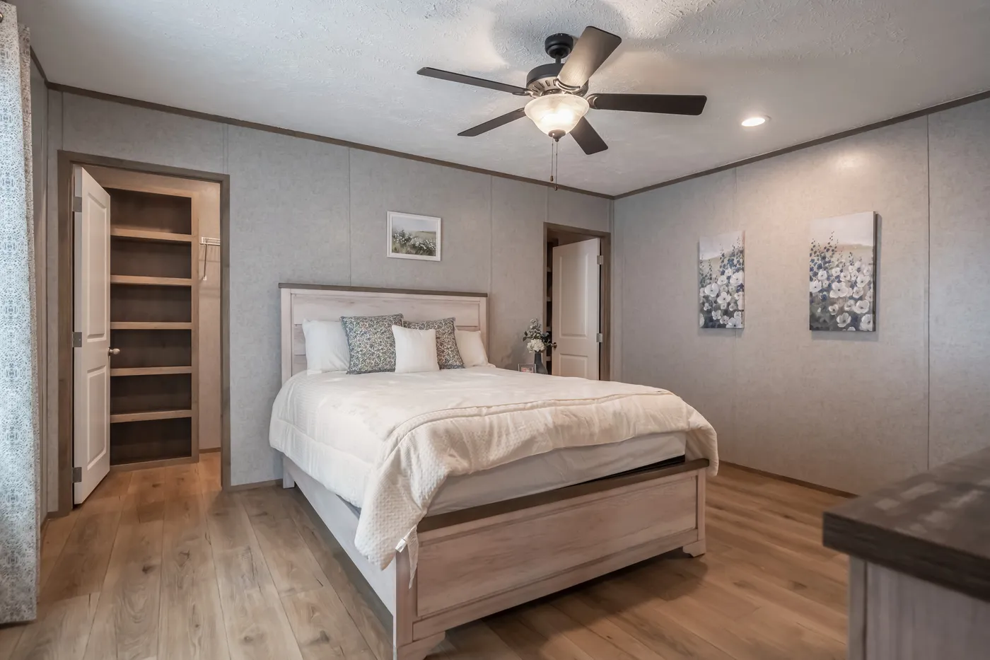 The WARRIOR II Primary Bedroom. This Manufactured Mobile Home features 2 bedrooms and 2 baths.