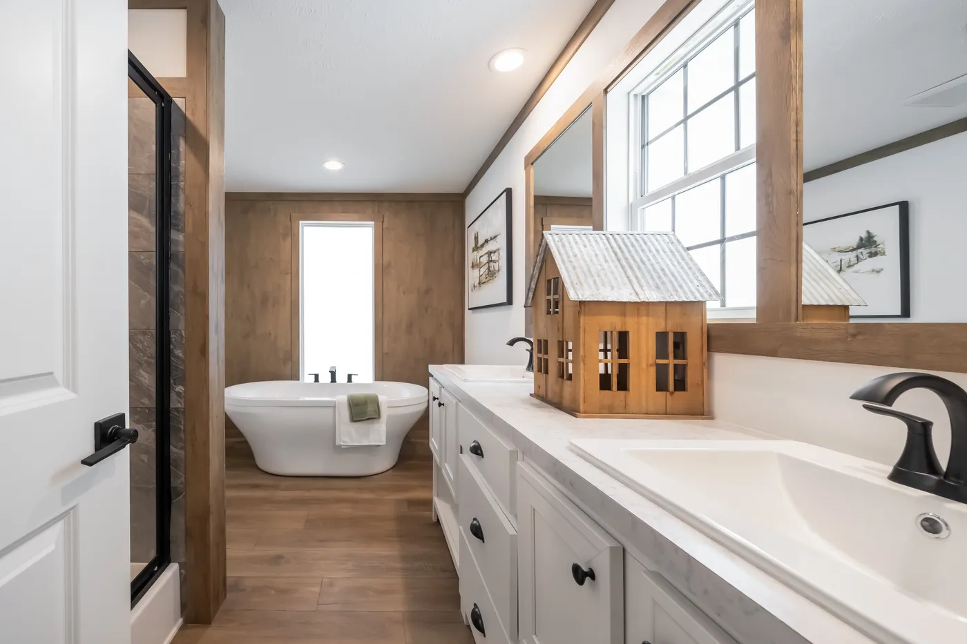The THE LIZZIE Primary Bathroom. This Manufactured Mobile Home features 3 bedrooms and 2 baths.