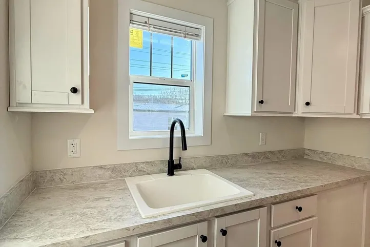 The TOMPKINS BLVD/6428-MS029-1 SEC Utility Room. This Manufactured Mobile Home features 3 bedrooms and 2 baths.
