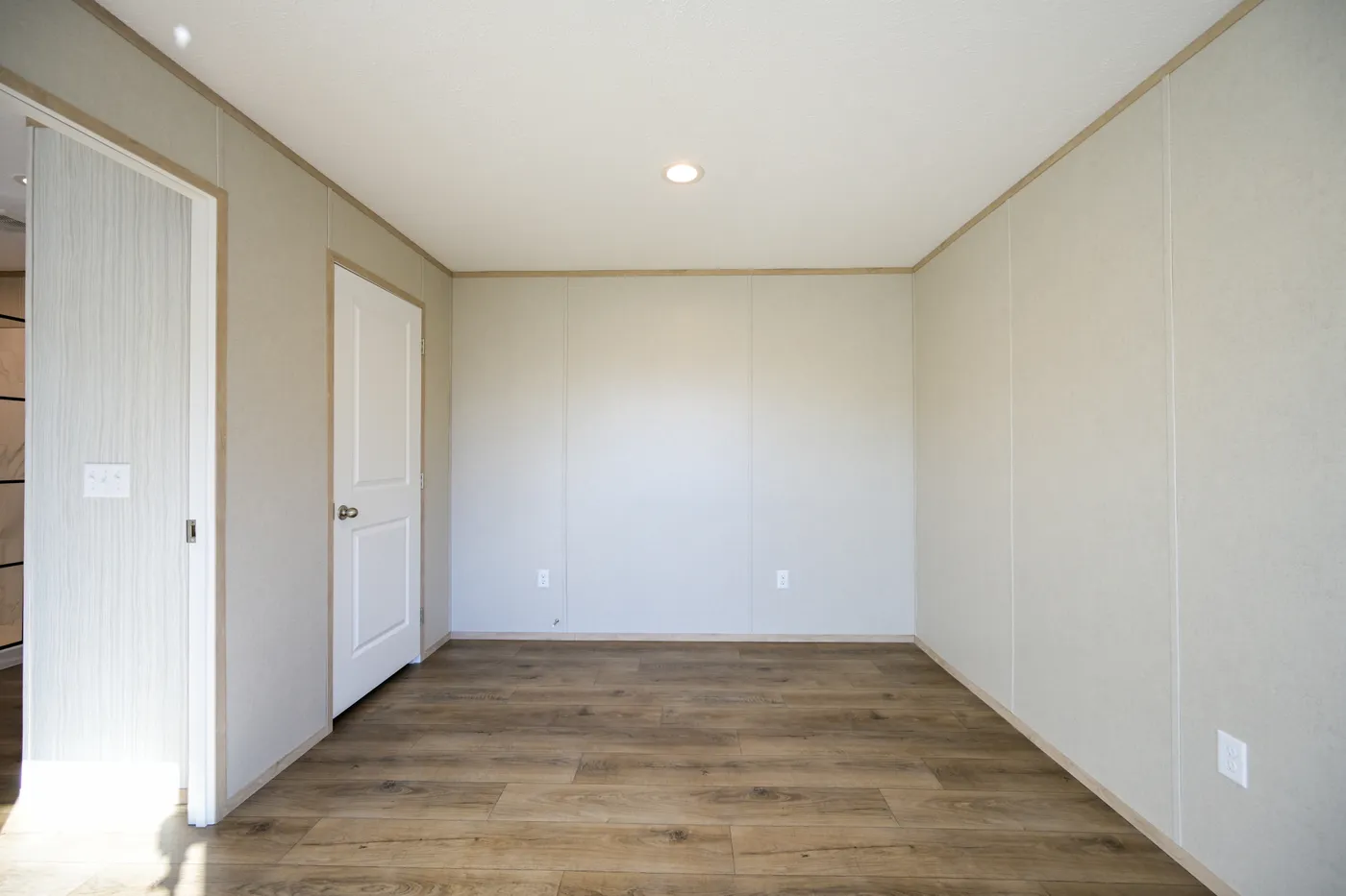 The TIGER'S EYE 7416-456 Primary Bedroom. This Manufactured Mobile Home features 3 bedrooms and 2 baths.