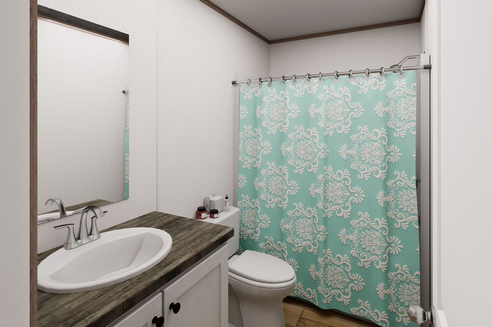 The ULTRA FLEX 48 Guest Bathroom. This Manufactured Mobile Home features 3 bedrooms and 2 baths.