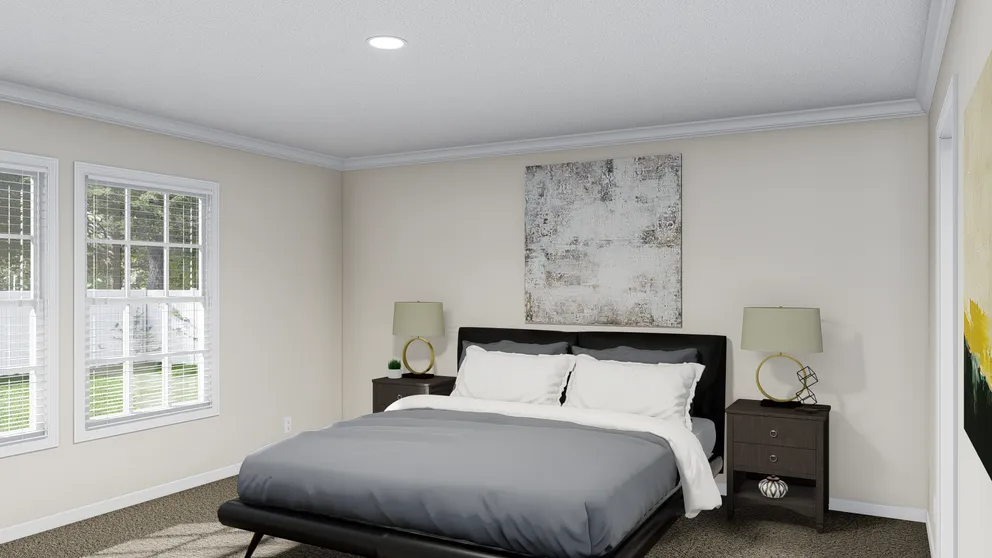 The PALMETTO 6101 Primary Bedroom. This Manufactured Mobile Home features 4 bedrooms and 2.5 baths.