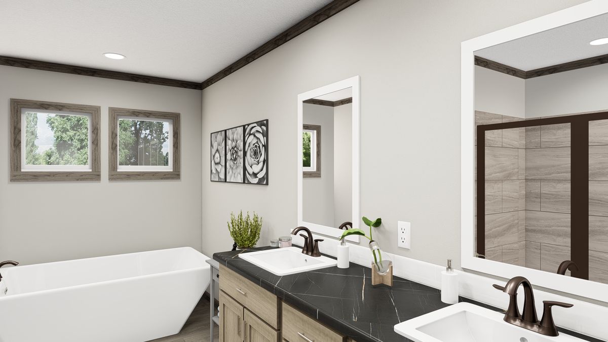 The THE MADISON Primary Bathroom. This Manufactured Mobile Home features 3 bedrooms and 2 baths.