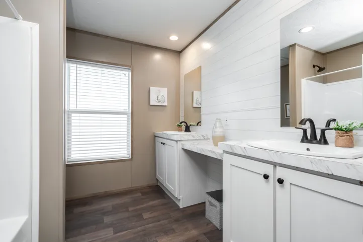 The FARMHOUSE BREEZE 72 Guest Bathroom. This Manufactured Mobile Home features 4 bedrooms and 2 baths.