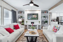 The THE REAL DEAL Living Room. This Manufactured Mobile Home features 3 bedrooms and 2 baths.